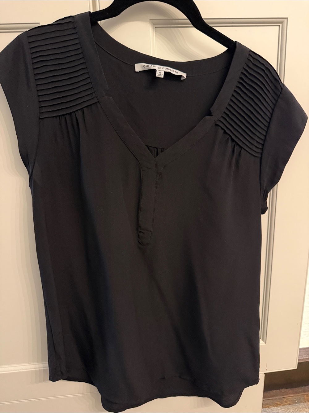 Collective Concepts Black V-Neck Top with Pleated Shoulder Panels
